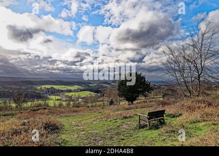 The view of the Surrey countryside from the North Downs with dramatic storm clouds forming, near Albury on a sunny winters day  England UK Stock Photo