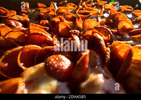 Messy Slices of Pepperoni Pizza on a tabletop Stock Photo