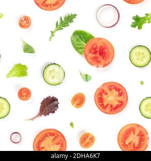 A seamless pattern of fresh vegetables and salad leaves. Tomato, cucumber, onion slices and mezclun leaves repeat print Stock Photo