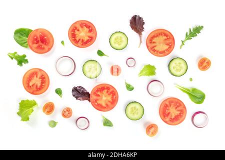 Fresh vegetable salad ingredients, shot from the top on a white background. A flat lay composition with tomato, cucumber, onion, Stock Photo