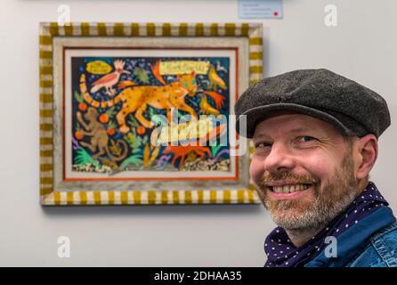 Mark Hearld, artist with one of his colourful prints, Scottish Gallery exhibition, Edinburgh, Scotland, UK Stock Photo