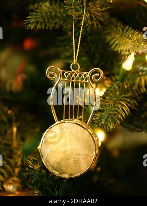 Stringed Instrument Christmas ornament on Christmas Tree Stock Photo