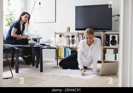 Female colleagues working in home office Stock Photo