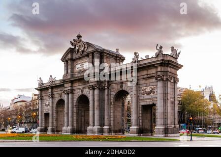 Madrid, Spain - December 6, 2020: Puerta de Alcala monument during Christmas time at sunset Stock Photo
