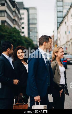 Multi-ethnic business colleagues standing in city Stock Photo
