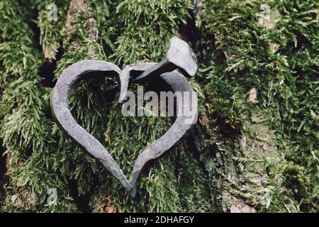 Forged heart and nail love concept Stock Photo