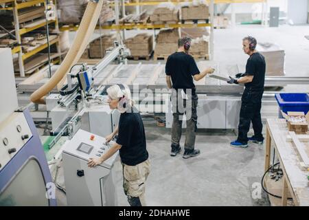 High angle view of workers working at lumber industry Stock Photo