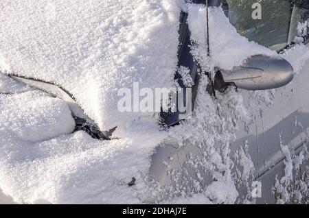 Accidental and off-road snowed-in car of the Smart brand. Stock Photo