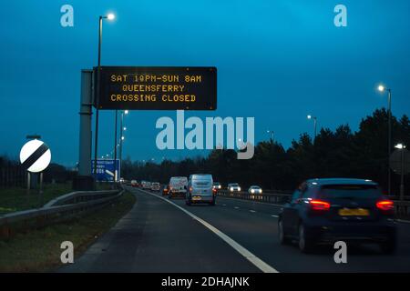 Glasgow, Scotland, UK. 10th Dec, 2020. Pictured: Motorway Road sign advising motorists not to travel over the Queensferry Crossing this weekend. Sign displays advisory warning, “SAT 10PM-SUN 8AM QUEENSFERRY CROSSING CLOSED” Credit: Colin Fisher/Alamy Live News Stock Photo
