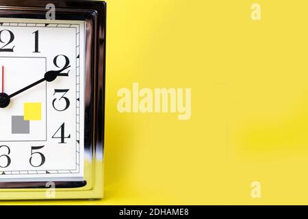 Color of the 2021 time concept with metal gold alarm clock and bright illuminating yellow and gray colours background. Shopping. Sale concept. Place for text.  Stock Photo