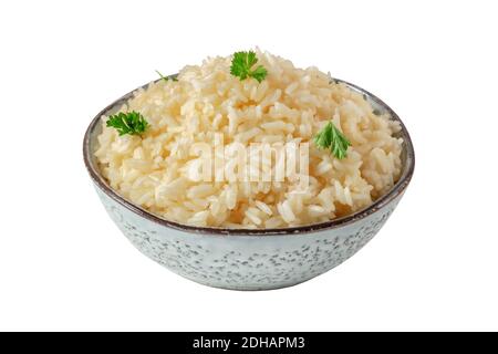 Rice, isolated on a white background with a clipping path. Minimal dish, cooked, served with fresh parsley Stock Photo