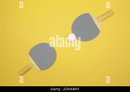Demonstrating trendy colors of the year 2021. Grey and yellow. Table tennis racket Stock Photo