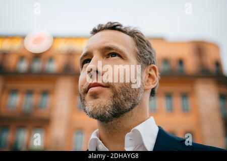 Close-up of thoughtful businessman looking away Stock Photo