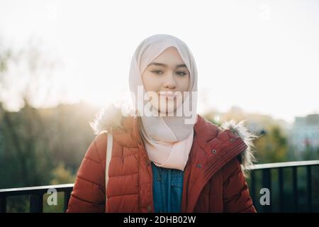 Portrait of confident young Muslim woman against clear sky Stock Photo