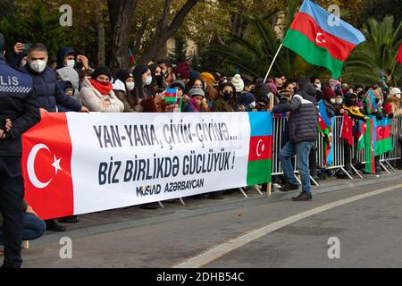 Baku - Azerbaijan: 10 December 2020. Azerbaijan celebrates Nagorno-Karabakh victory. People with Azerbaijani and Turkish flags Stock Photo