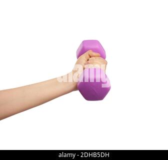 Female hand holds a plastic pink dumbbell on a white isolated background Stock Photo