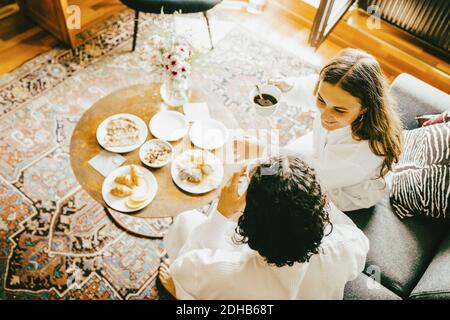 High angle view of young couple having breakfast in hotel room Stock Photo