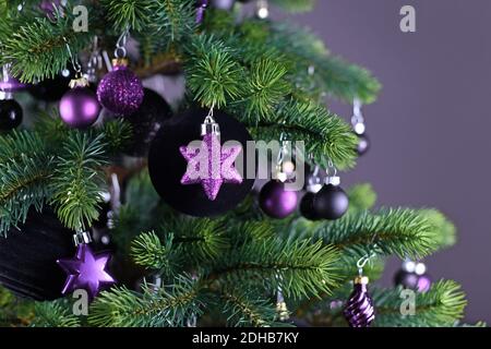 Christmas baubles on a purple background close up Stock Photo - Alamy