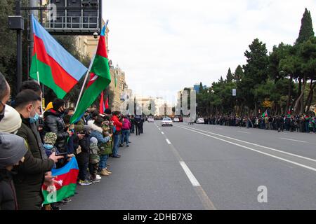 Baku - Azerbaijan: 10 December 2020. Azerbaijan celebrates Nagorno-Karabakh victory. People with Azerbaijani and Turkish flags Stock Photo