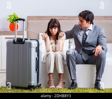 Wife seeing her husband off to business trip Stock Photo