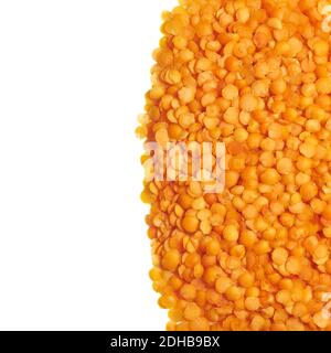 Close up picture of yellow lentils isolated on white background. Stock Photo