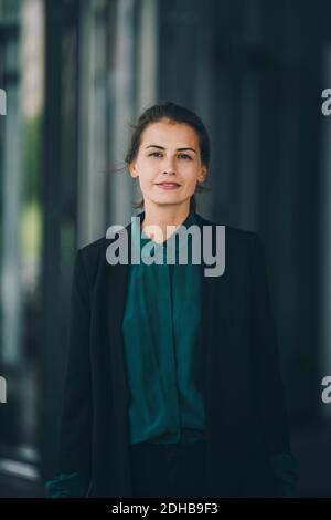 Portrait of confident businesswoman standing in city Stock Photo