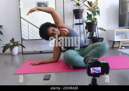 African american female vlogger recording a video Stock Photo