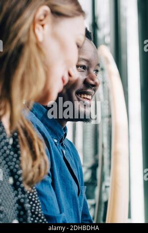 Close-up of businesswoman and man talking at office Stock Photo