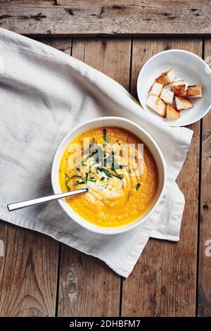 Cream of pumpkin soup with croutons on white background Stock Photo - Alamy