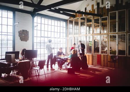Business colleagues planning strategies for new IT project at workplace Stock Photo