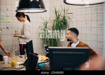 Young multi-ethnic computer programmers working at creative office Stock Photo