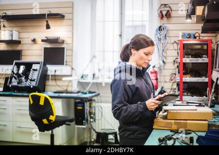 Engineer holding digital tablet in computer store Stock Photo