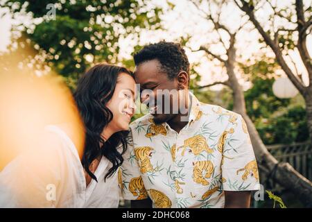 Smiling multi-ethnic couple spending leisure time during weekend Stock Photo