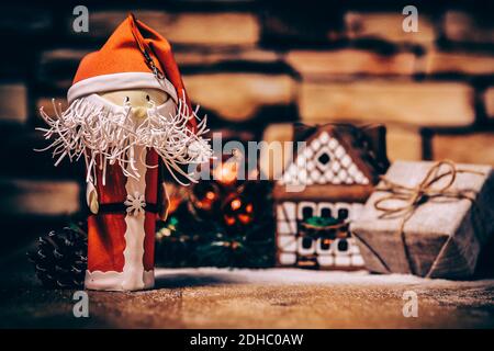 gift for Christmas ,gingerbread house, a toy Santa Claus. Stock Photo