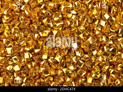 Abstract background texture of colorful bright golden nuggets Stock Photo