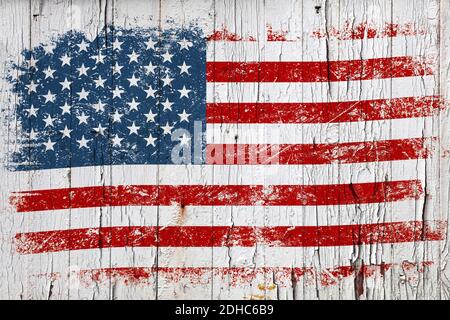 Grunge American flag on old weathered white painted wooden surface background Stock Photo