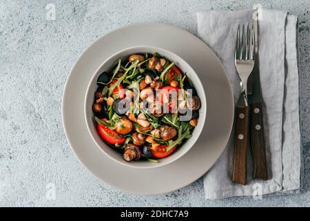 Salad with arugula, mini champignons Stock Photo