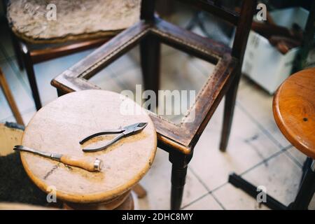 High angle view of hand tools on table in upholstery workshop Stock Photo