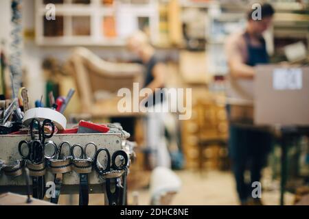 Scissors on rack in upholstery workshop Stock Photo