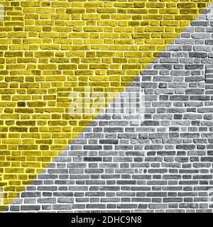 Demonstrating trendy colors 2021 - Gray and Yellow. Beautiful accurate textured brick wall on a bright sunny day. Brick background Stock Photo
