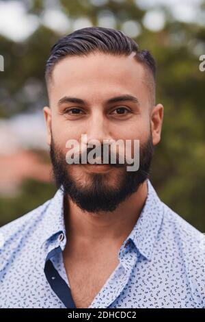 Portrait of confident bearded man at party Stock Photo