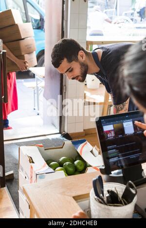 Multi-ethnic colleagues working at restaurant Stock Photo