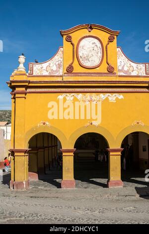 The old town market building in the beautiful colonial village of Bernal, Queretaro, Mexico. Bernal is a quaint colonial town known for the Pena de Bernal, a giant monolith which dominates the tiny village is the third highest on the planet. Stock Photo