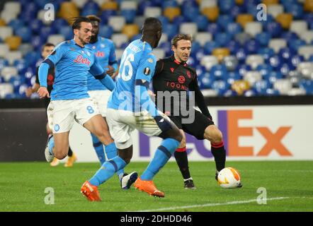 Naples, Italy. 10th Dec, 2020. Real Sociedad's Spanish defender Nacho Monreal kicks the ball next to Napoli's Spanish midfielder Fabian Ruiz during the UEFA Europa League Group F football match SSC Napoli vs Real Sociedad de Futbol. Napoli and Real Sociedad drew 1-1. Credit: Independent Photo Agency/Alamy Live News Stock Photo