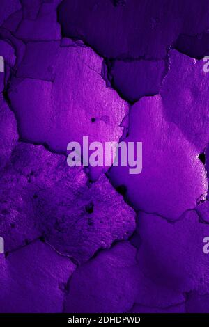 Old cracked wall in grape color Stock Photo
