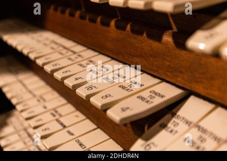 Pipe organ keyboard controls close up vintage style in english Stock Photo