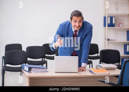 Young businessman making presentation during pandemic Stock Photo