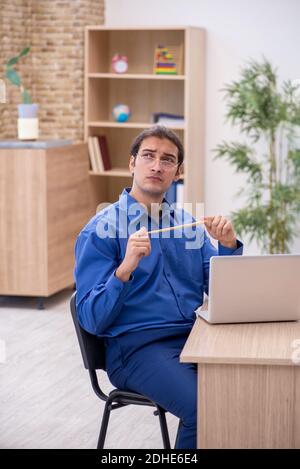 Young male teacher in tele-education concept Stock Photo