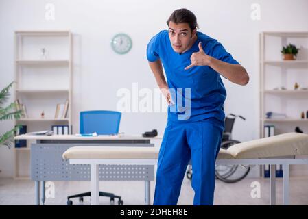 Young male doctor working in the clinic Stock Photo