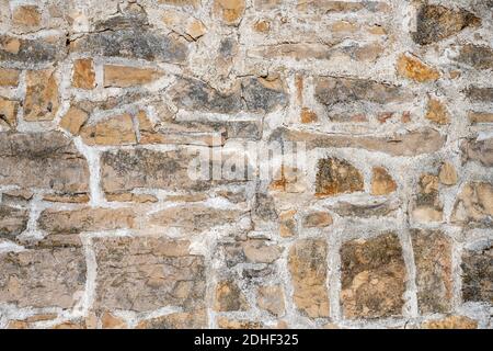 Background from an irregular natural stone wall Stock Photo
